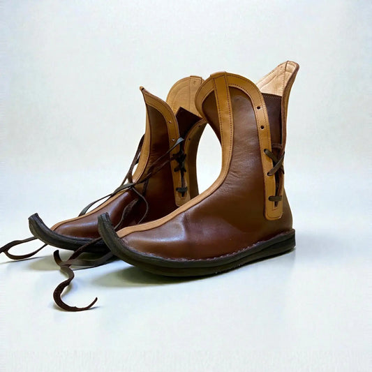 Handmade Viking Leather Boots displayed from the side view, showcasing intricate craftsmanship and unique design.